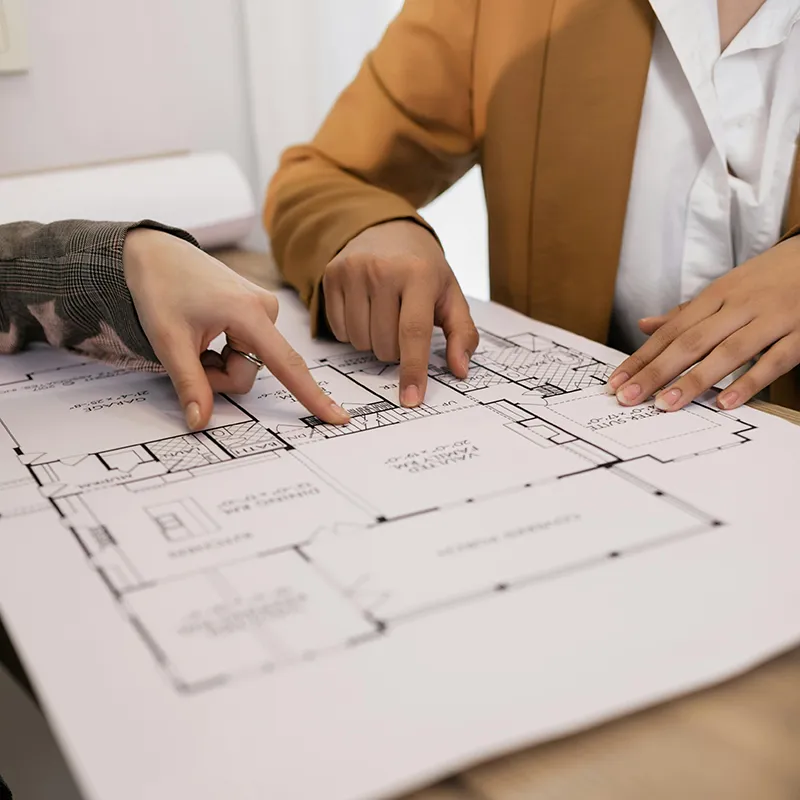 2 people discussing over property plans